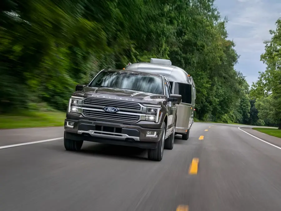2026 Ford F-150 full-size pickup towing a trailer