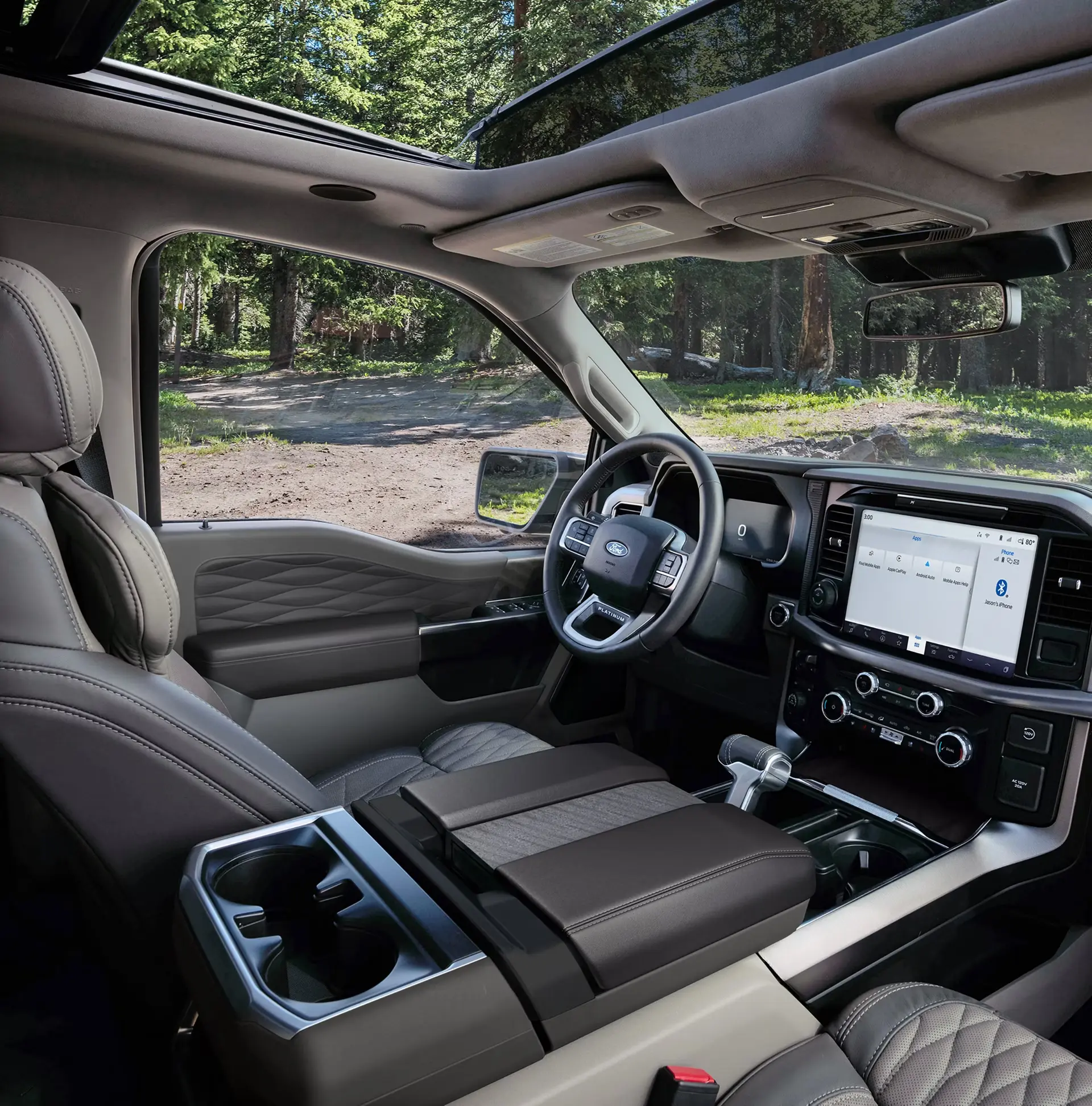 Interior of a Ford truck cabin with panoramic roof and infotainment screen