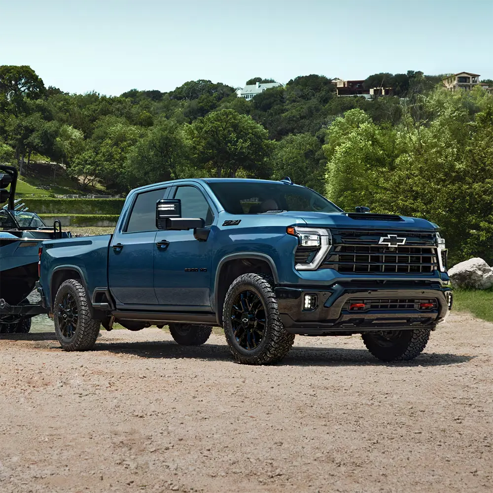 2026 Chevrolet Silverado HD towing a boat