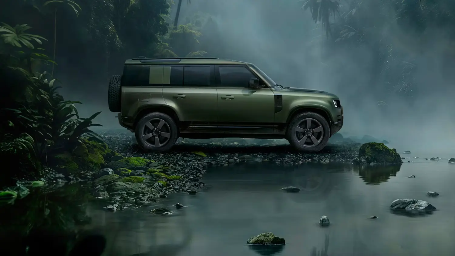 Green Defender 110 beside still water in a misty forest