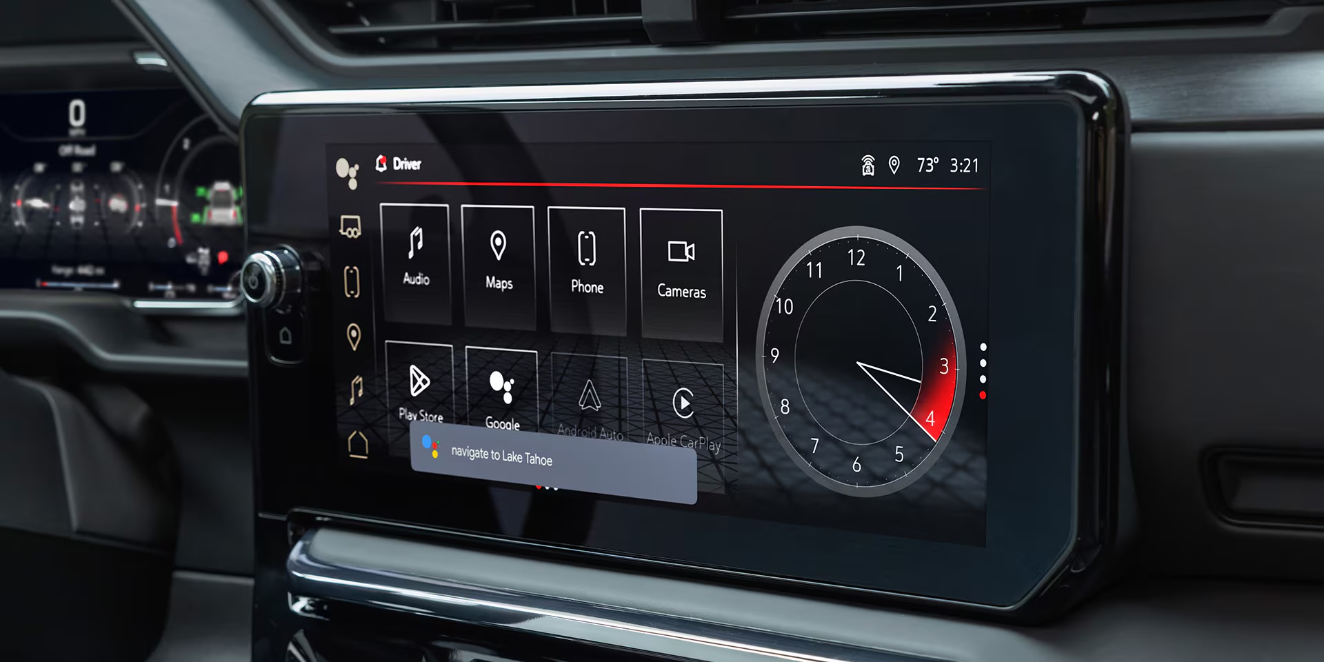 The 13.4-inch touchscreen inside a 2026 GMC Sierra 1500 AT4 showing audio, maps, phone, camera and Google Assistant controls