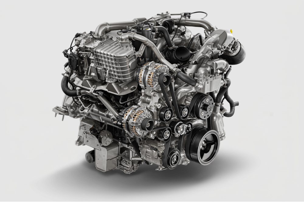 Studio render of a turbocharged V8 engine with its intake and belt drive visible, on a white background